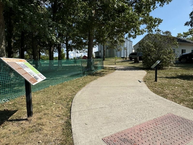 Marker on walkway at entrance to the park from the south image. Click for full size.