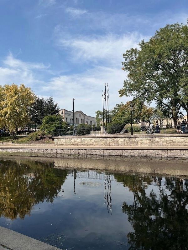 A view of the Riverwalk Visionaries statue from across the river. Click for full size. A view of the Riverwalk Visionaries statue from across the river image. Click for full size.