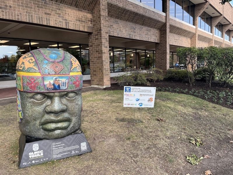 Olmec head in front of Nichols Library image. Click for full size.