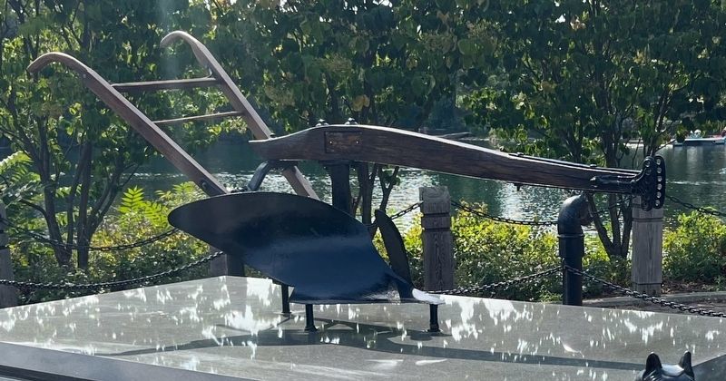 Antique Plow on top of the monument, with Quarry Lake in the background. Click for full size. Antique Plow on top of the monument, with Quarry Lake in the background image. Click for full size.