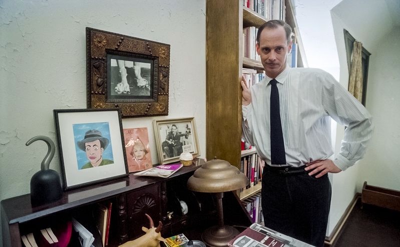 John Waters, film producer/director, in his home. Click for more information. John Waters, film producer/director, in his home image. Click for more information.