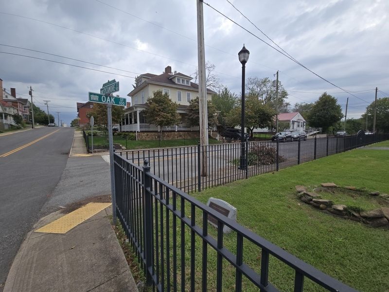 Solar Hill/ Sycamore Street Marker behind the fence. Street corner signs at the upper left. Click for full size. Solar Hill/ Sycamore Street Marker behind the fence. Street corner signs at the upper left image. Click for full size.