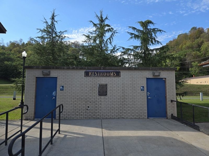 Wide view of No. 11 Marker, between the men and women's restrooms. Locomotive is to the left image. Click for full size.