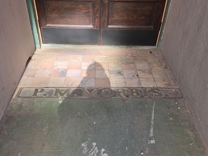P.M. Morris etching at the entrance to the building. image. Click for full size.