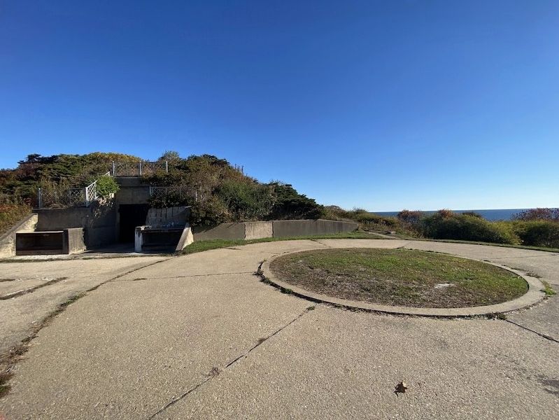 The view looking north to the casemate. Round circle in the foreground is the six-inch gun mount. image. Click for full size.