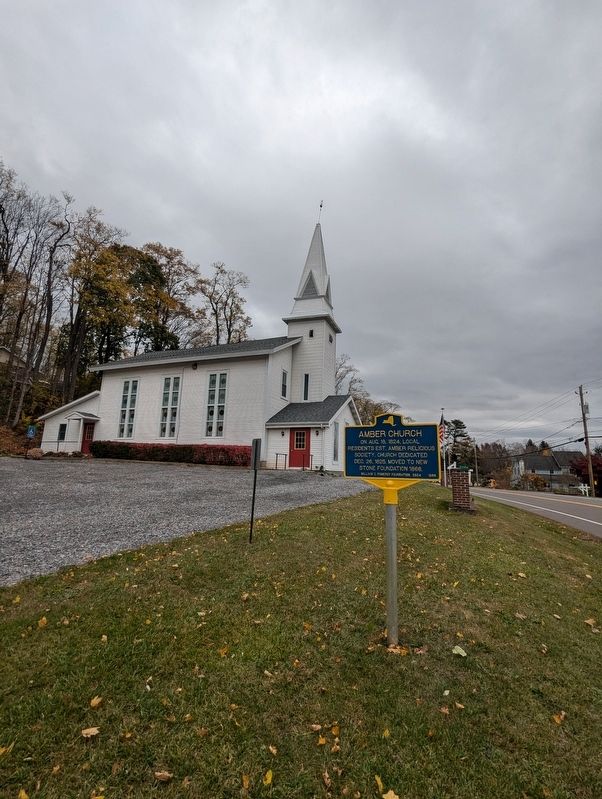 Amber Church Marker with the church in the background. Click for full size. Amber Church Marker with the church in the background image. Click for full size.