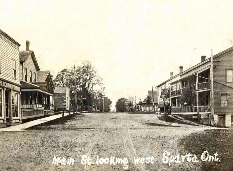 Main Street, Sparta, ca 1920. The Abbey is visible in its orignal location (mid-right) image. Click for full size.
