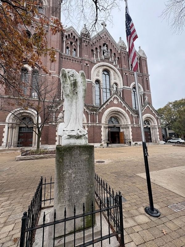 St. Michael Archangel statue and St. Michael's Church behind it. Click for full size. St. Michael Archangel statue and St. Michael's Church behind it image. Click for full size.