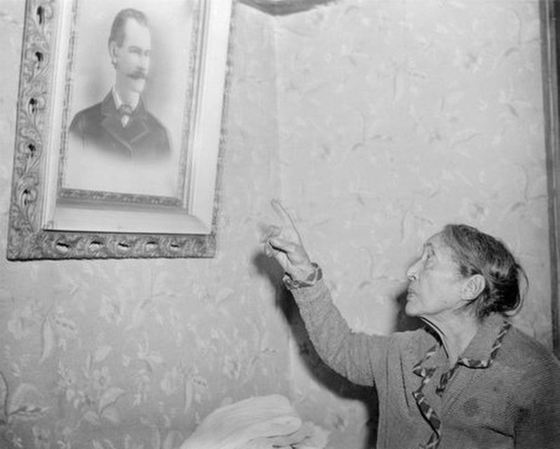 Lucy Parsons, pointing to a photograph of her husband Albert. Click for full size. Lucy Parsons, pointing to a photograph of her husband Albert image. Click for full size.