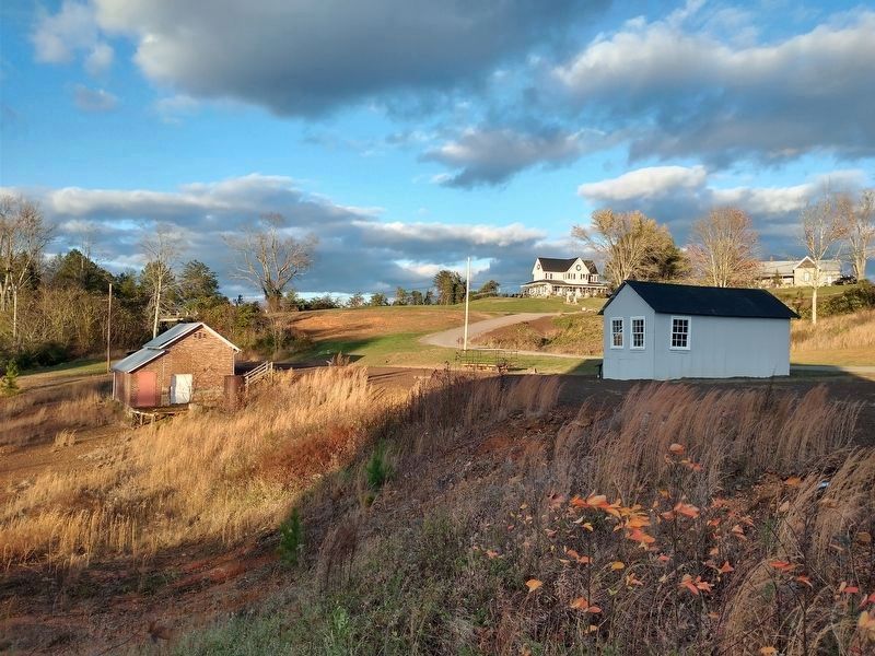 The Bit House (right), Powder House (left), and Mine Official's Homes (background). image. Click for full size.