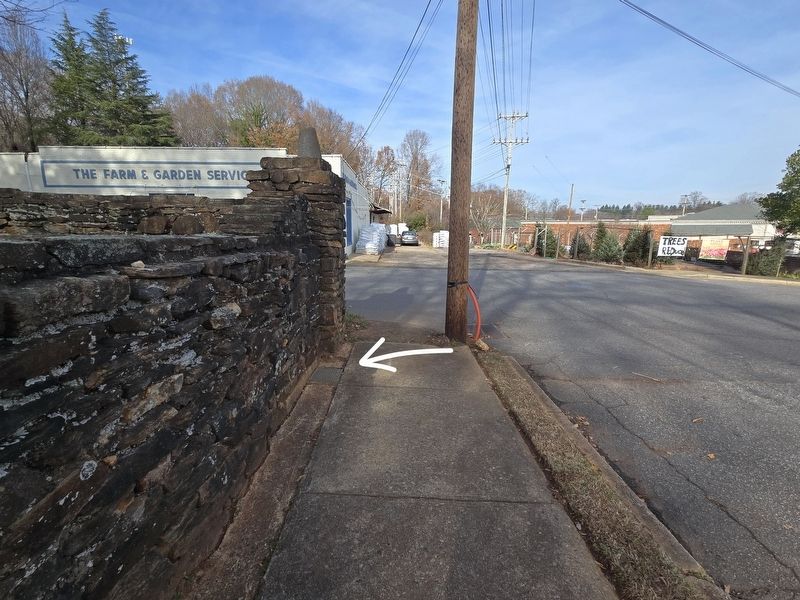 Original Town Limits of Statesville Marker indicated by the arrow. Looking west on Debow Street image. Click for full size.