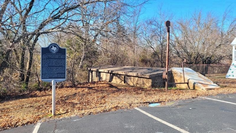 The Antioch Baptist Church Marker is next to a large storm shelter. Click for full size. The Antioch Baptist Church Marker is next to a large storm shelter image. Click for full size.