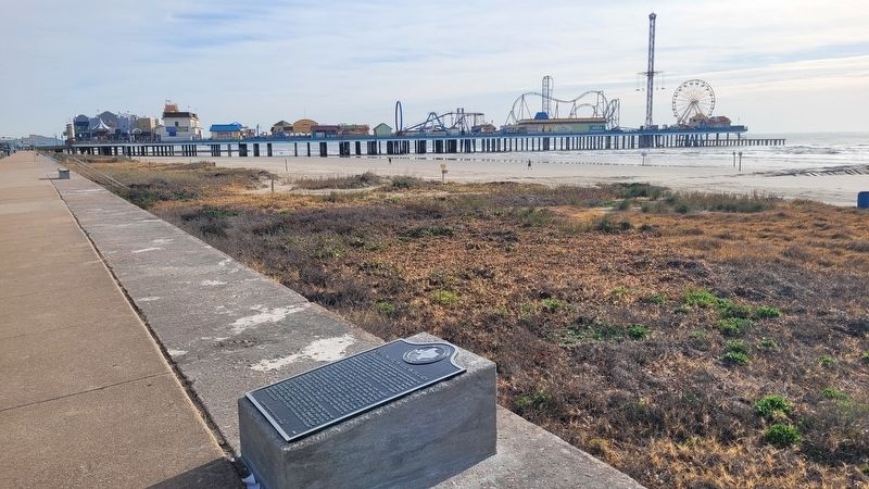 The view of the marker along the seawall and beach. Click for full size. The view of the marker along the seawall and beach image. Click for full size.