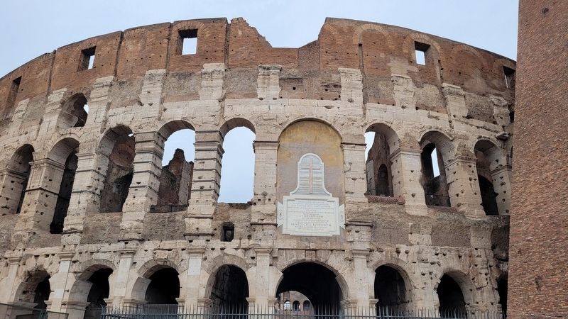 The Flavian Amphitheater Marker on the Colosseum. Click for full size. The Flavian Amphitheater Marker on the Colosseum image. Click for full size.