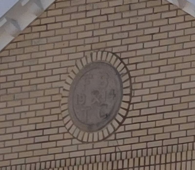 "FB&TC 1914" carving at the top of the storefront image. Click for full size.