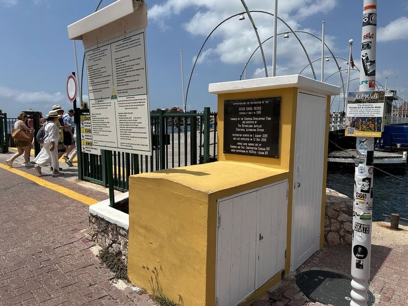Queen Emma Bridge Marker - wide view image. Click for full size.