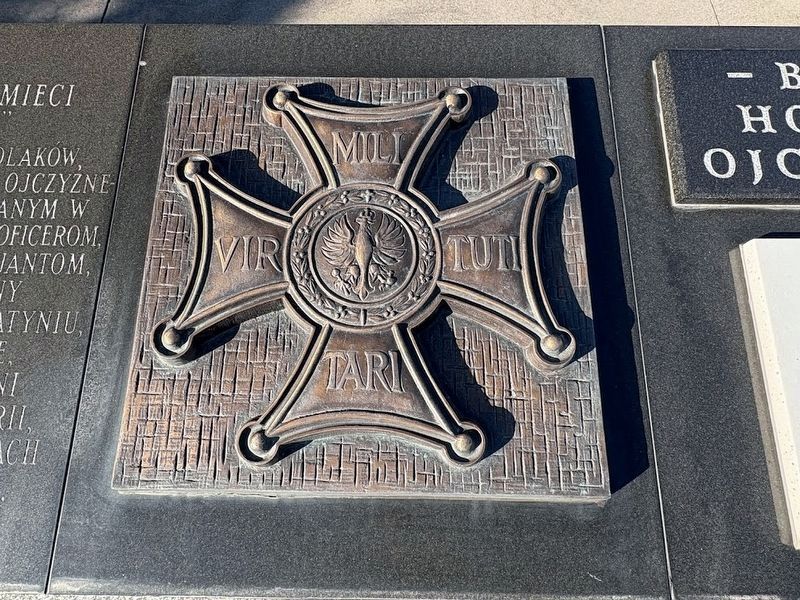 Bronze military cross at Katyń Massacre Memorial. Click for full size. Bronze military cross at Katyń Massacre Memorial image. Click for full size.