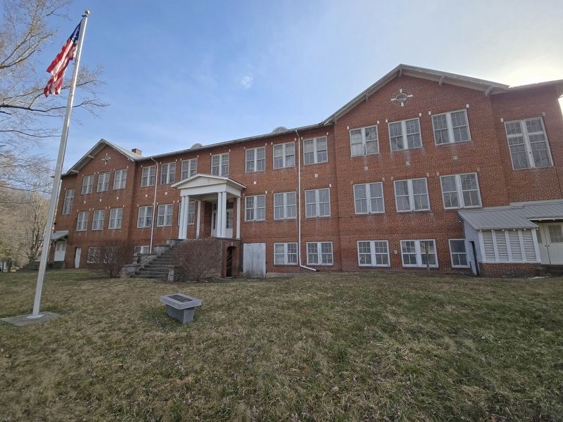 Former Cranberry High School. Bench is near the flagpole image. Click for full size.