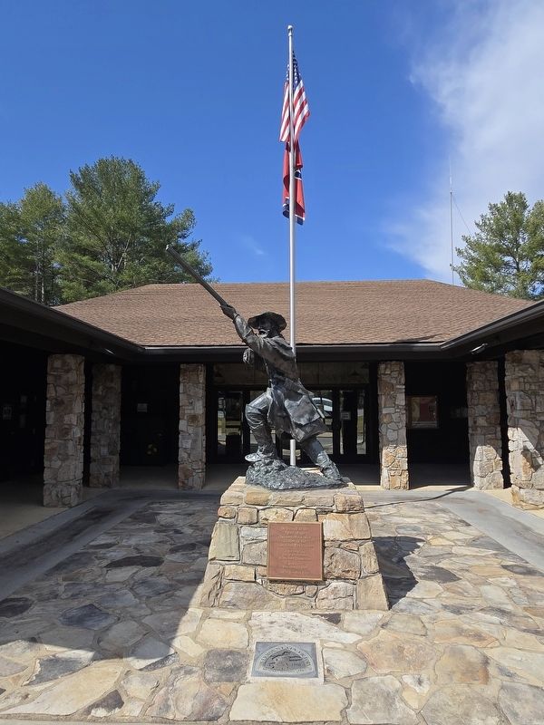 Overmountain Men statue and marker in front of the Sycamore Shoals Park Visitor's Center image. Click for full size.