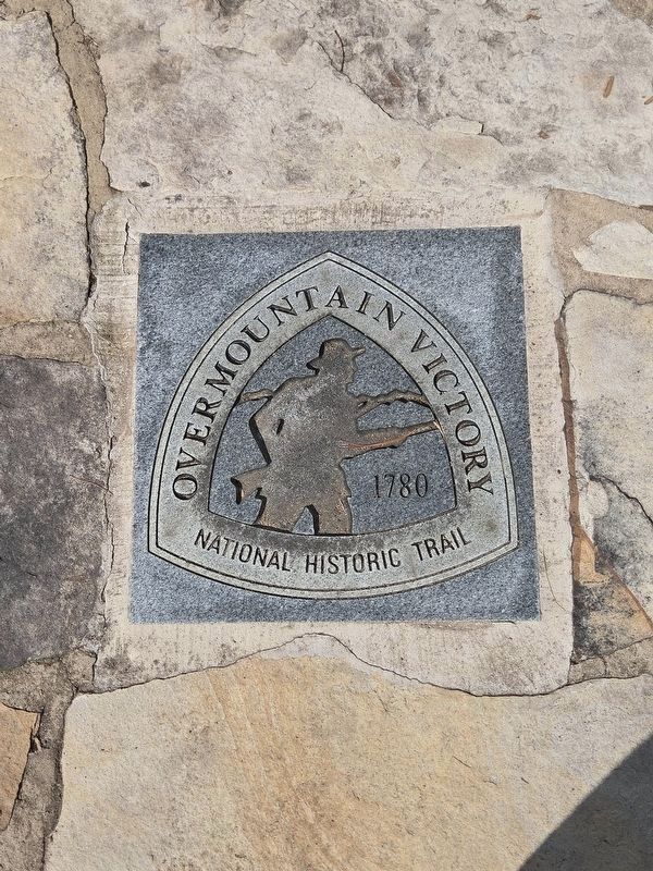 Overmountain Men National Historic Trail Marker in front of the statue image. Click for full size.