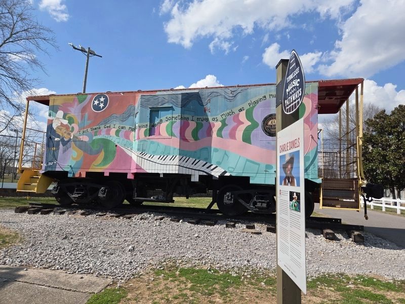 Charlie Daniels Marker next to a Daniels mural on a caboose.. Click for full size. Charlie Daniels Marker next to a Daniels mural on a caboose. image. Click for full size.