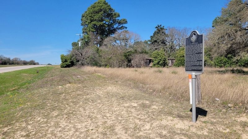 The view of the marker along the highway. Click for full size. The view of the marker along the highway image. Click for full size.