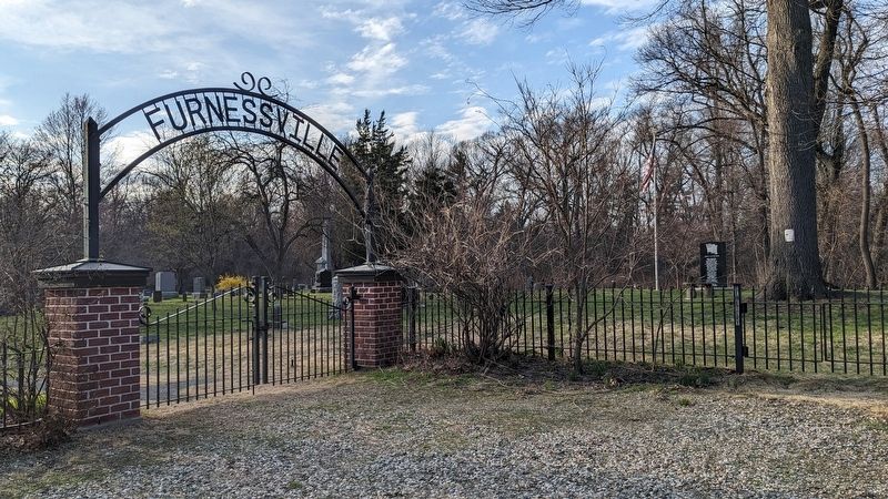 Memorial with the Furnessville Cemetery gate. Click for full size. Memorial with the Furnessville Cemetery gate image. Click for full size.
