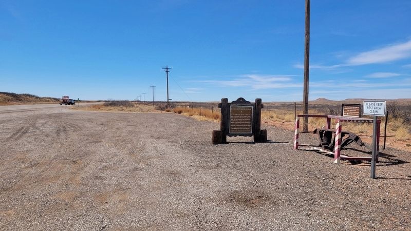 The view of the marker along the highway. Click for full size. The view of the marker along the highway image. Click for full size.