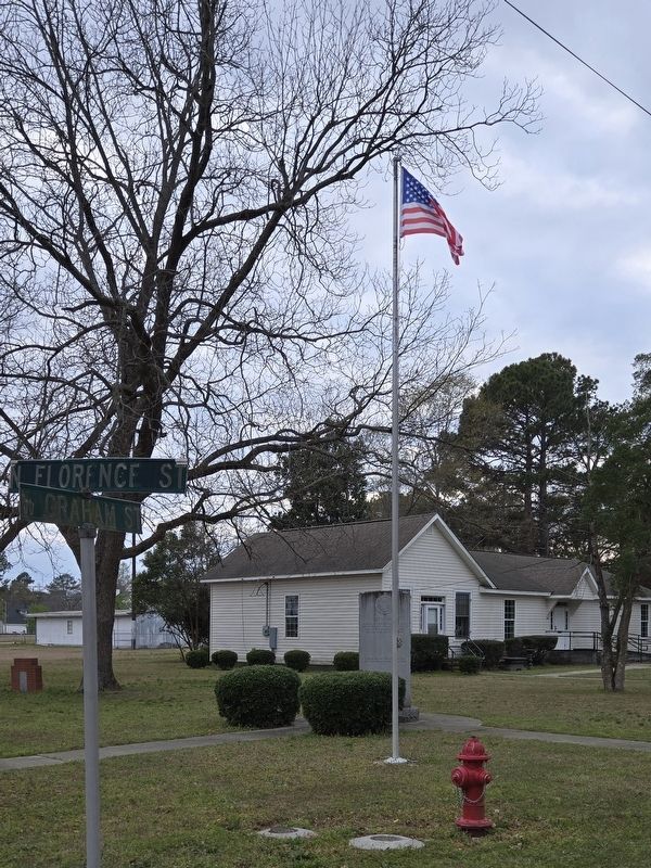 Wide view of memorial with flag image. Click for full size.