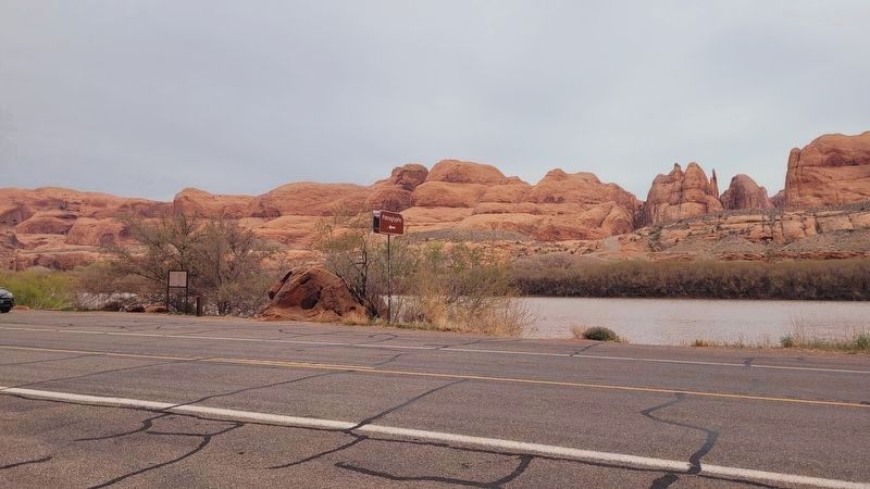The view of the road and marker along the river. Click for full size. The view of the road and marker along the river image. Click for full size.