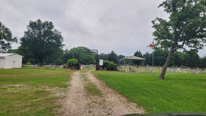 The view of the entrance to the Dew Cemetery. Click for full size. The view of the entrance to the Dew Cemetery image. Click for full size.