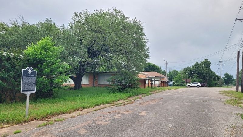 The view of the Dogan High School and Marker along the road image. Click for full size.