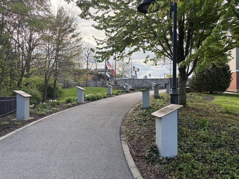 Historical markers about American wars on the pathway behind Oswego Veterans Memorial Plaza image. Click for full size.