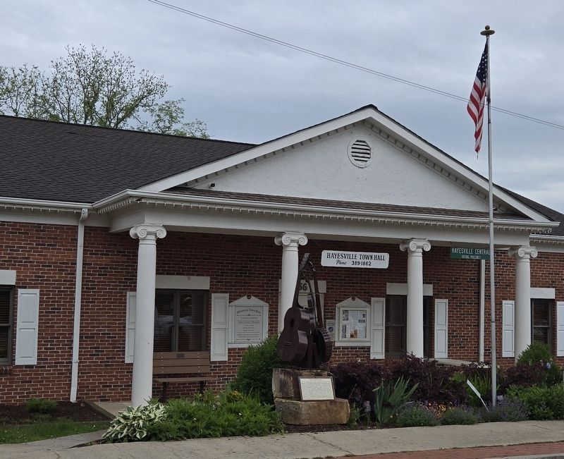 Wide view of sculpture & marker in front of the Hayesville Town Hall image. Click for full size.