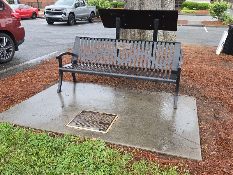 A Bench by the Road Marker and Bench by public parking lot image. Click for full size.