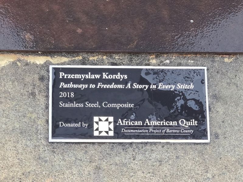 Pathways to Freedom: A Story in Every Stitch display tag image. Click for full size.