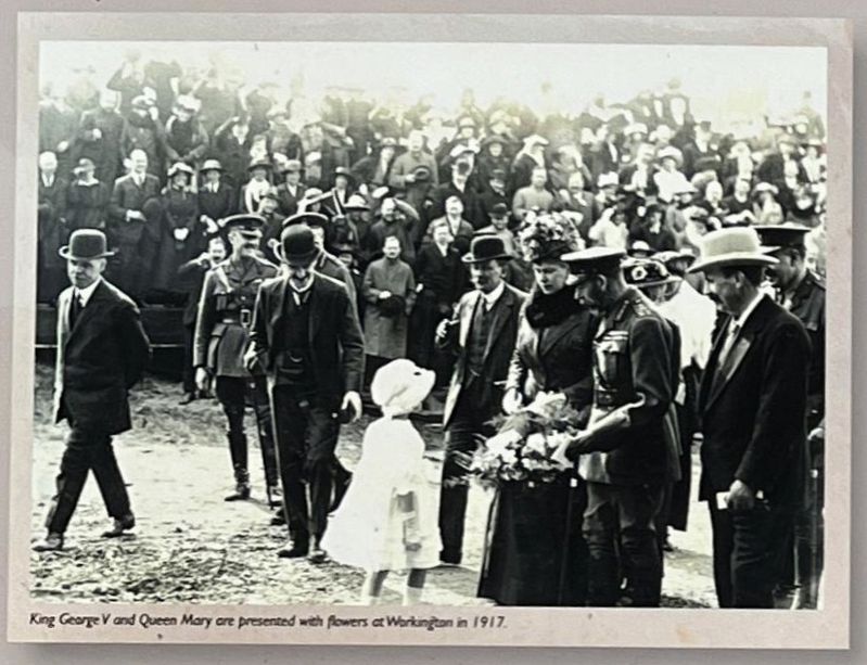 King George V and Queen Mary are presented with flowers at Workington in 1917. image. Click for full size.