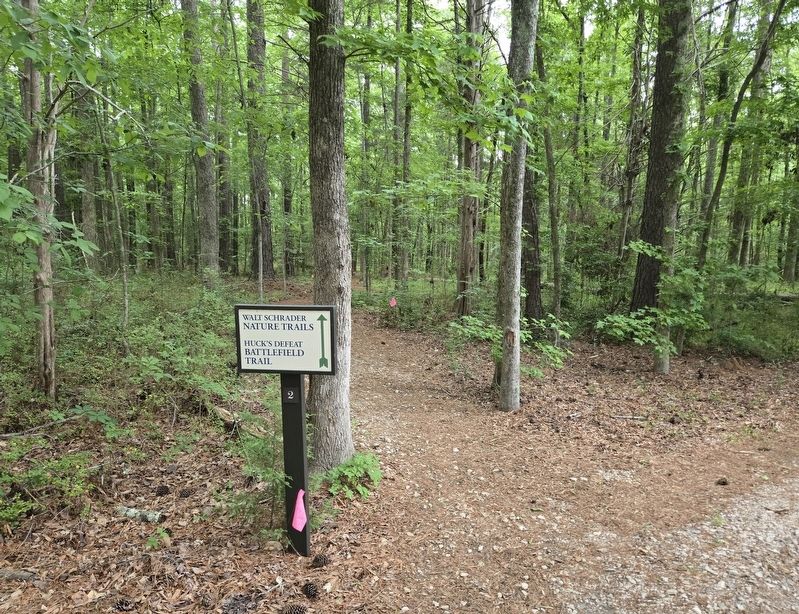 Battlefield Trail sign behind the visitors center image. Click for full size.