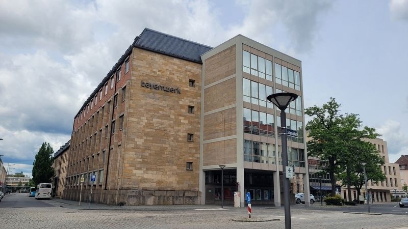 The view of the marker along the street next to the building. Click for full size. The view of the marker along the street next to the building image. Click for full size.