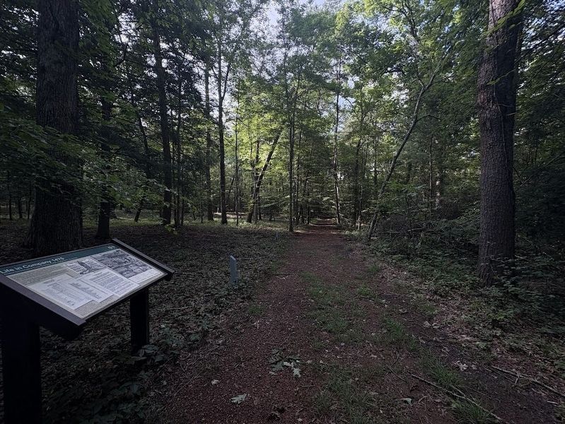 Life in Company 1475 Marker (looking down the perimeter road) image. Click for full size.