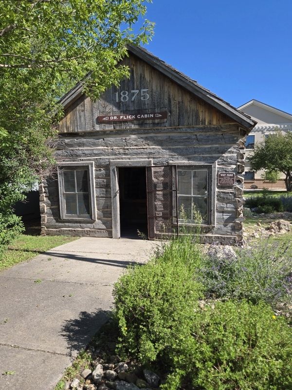 The 1875 Dr. Flick cabin. Way Park Marker as at the front right corner of the cabin image. Click for full size.