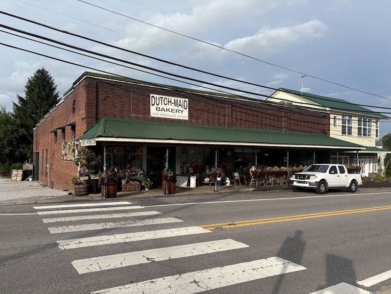 Dutch Maid Bakery Marker (marker is just above wooden barrel to at the left edge of building) image. Click for full size.