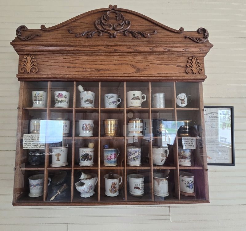 Mug Racks with personal shaving mugs of customers. Click for full size. Mug Racks with personal shaving mugs of customers image. Click for full size.