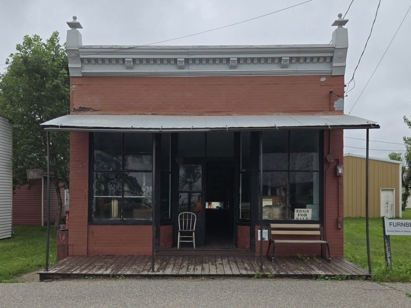 Furnberg Store. Marker is to the lower right of the entrance near the bench. Click for full size. Furnberg Store. Marker is to the lower right of the entrance near the bench image. Click for full size.