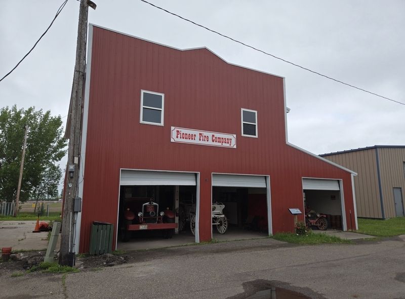 Replica Pioneer Fire Company building. Marker it's between the center and right garage door. Click for full size. Replica Pioneer Fire Company building. Marker it's between the center and right garage door image. Click for full size.