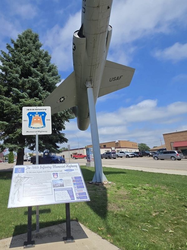 The 164th Infantry Memorial Highway Marker next to Highway sign and USAF jet. Click for full size. The 164th Infantry Memorial Highway Marker next to Highway sign and USAF jet image. Click for full size.
