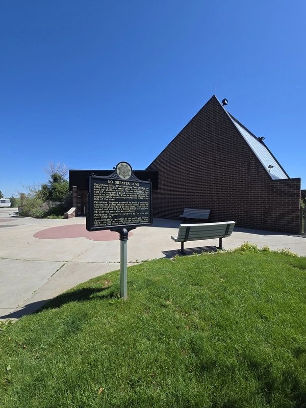No Greater Love Marker in front of the Dwyer Junction rest area building. Click for full size. No Greater Love Marker in front of the Dwyer Junction rest area building image. Click for full size.