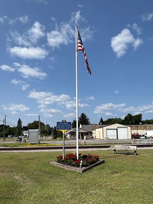 Train Wreck Marker With Red Jacket Community Library In The Background image. Click for full size.