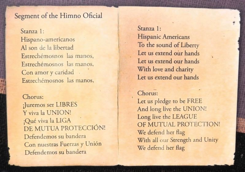 Marker detail: Segment of the Himno Oficial in Spanish and English. Click for full size. Marker detail: Segment of the Himno Oficial in Spanish and English image. Click for full size.