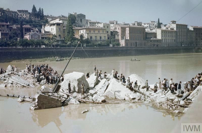 Civilians cross the ruins of the Ponte Alle Grazia in Florence. Click for full size. Civilians cross the ruins of the Ponte Alle Grazia in Florence image. Click for full size.